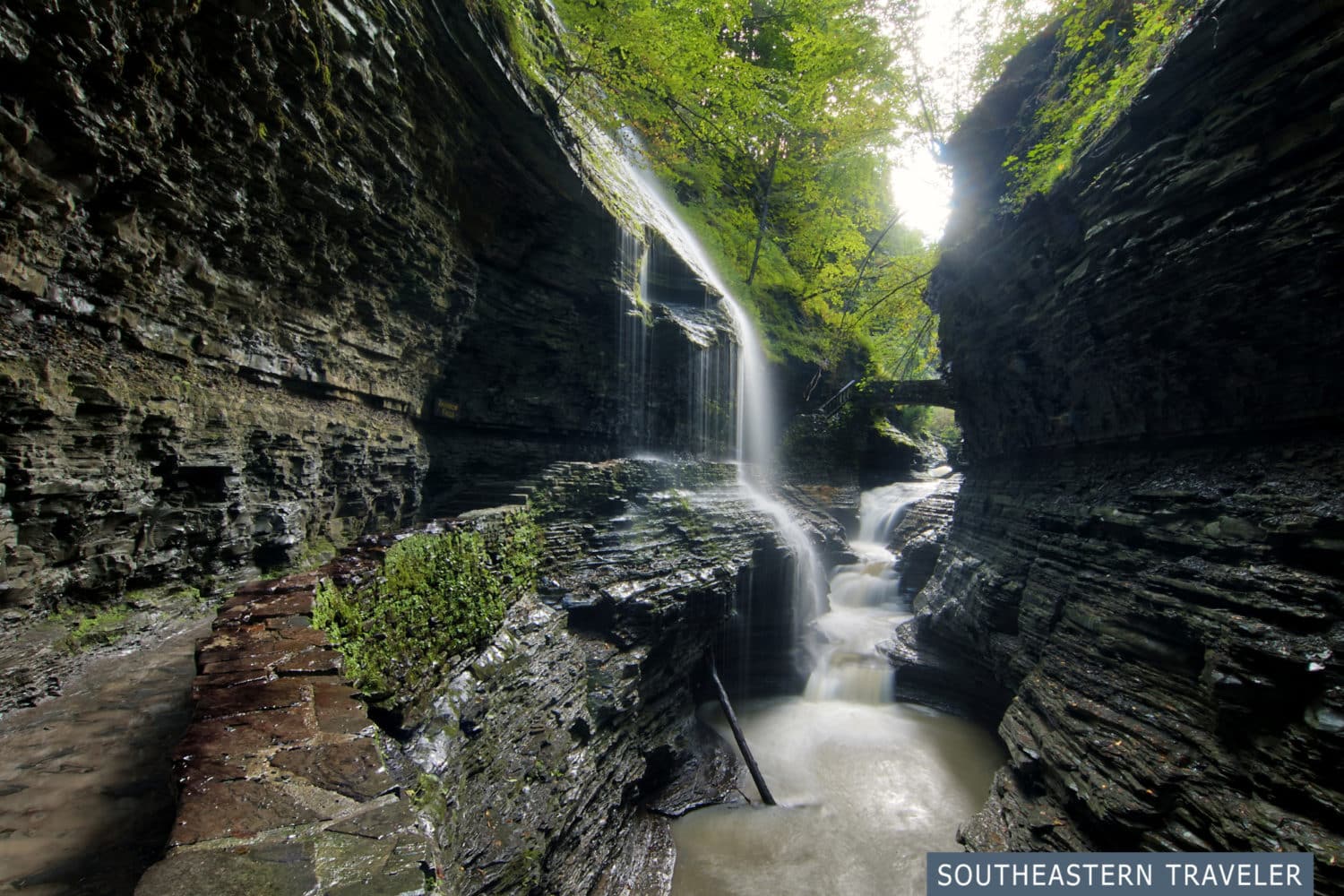 Rainbow Falls, a waterfall crashing over the Gorge Trail, at Watkins Glen State Park in New York