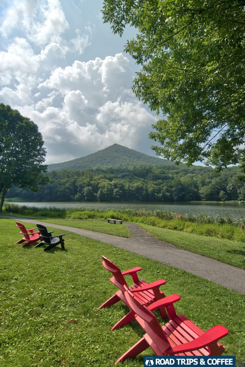 Sharp Top Mountain rises quickly in the distance beyond Abbott Lake at the Peaks of Otter on the Blue Ridge Parkway in Virginia